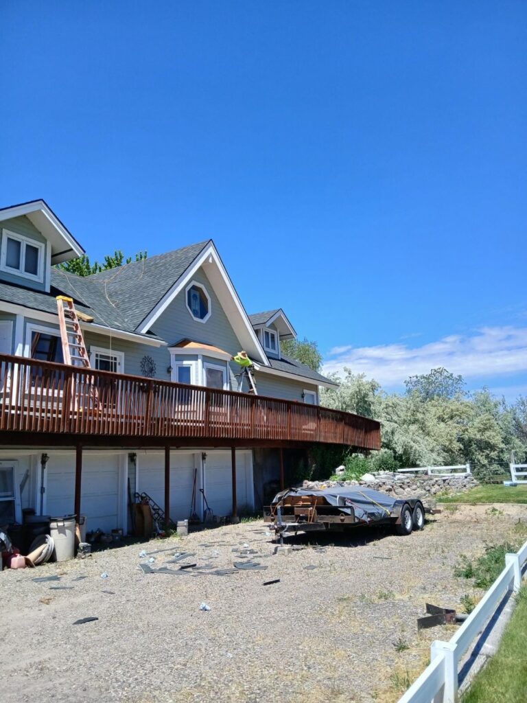 Treasure Valley Roofing removing old materials from a roof that's being replaced. 